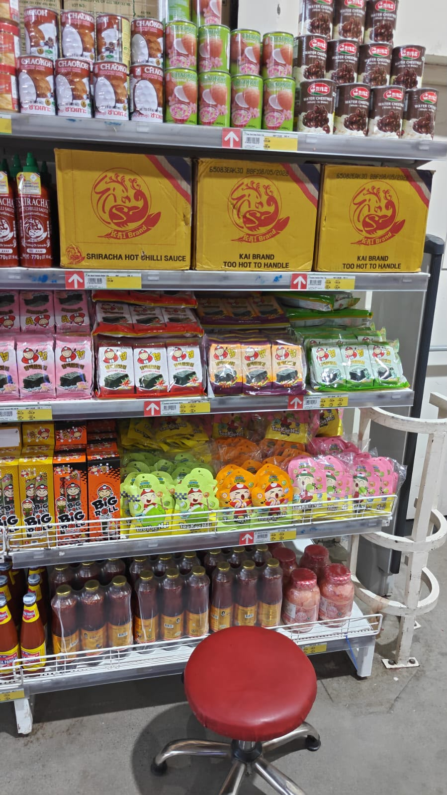 Tao Kae Noi seaweed and Big Roll products displayed on shelf at LOTS Wholesale