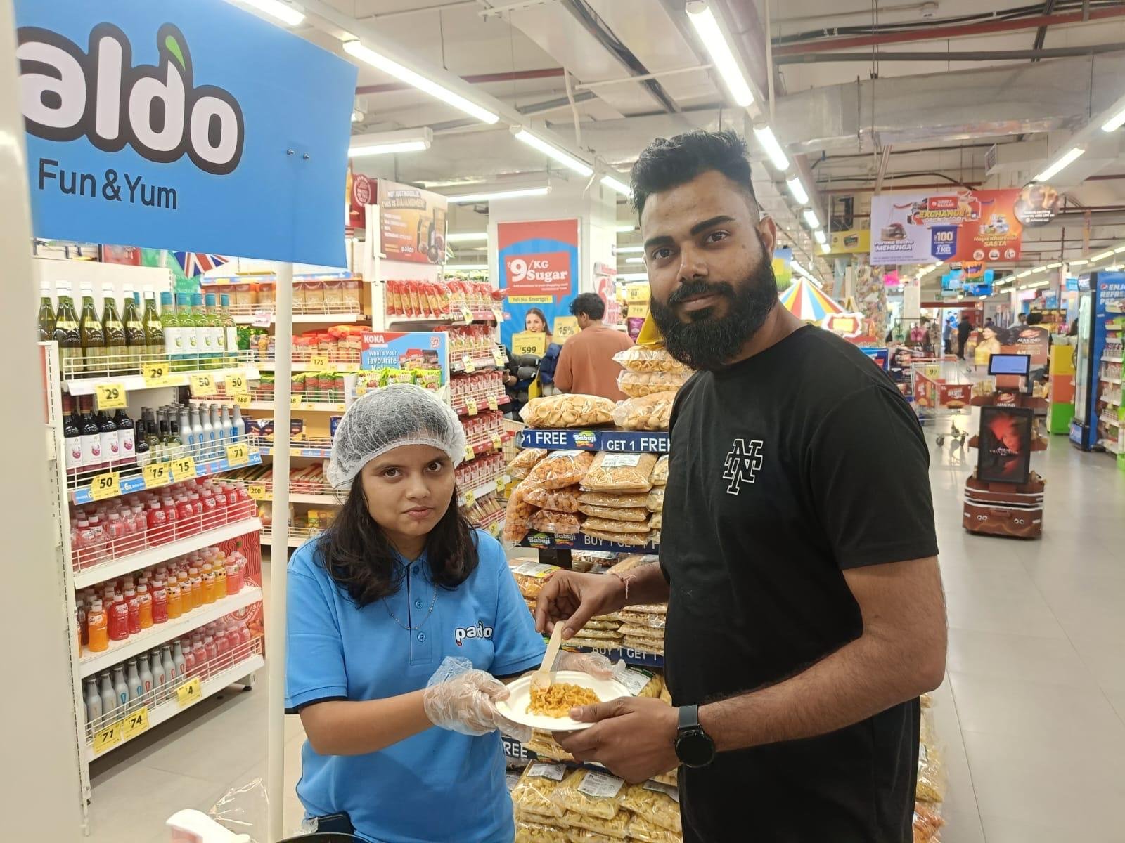 Paldo in-store product sampling with an Indian shopper
